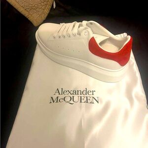 Red and white Alexander McQueen size 48, which is size 14 in men's